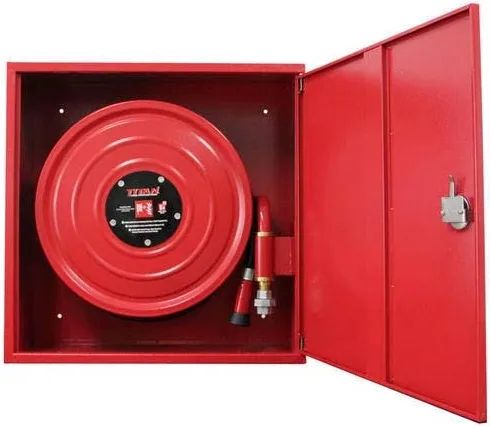 Red fire hose reel inside an open cabinet
