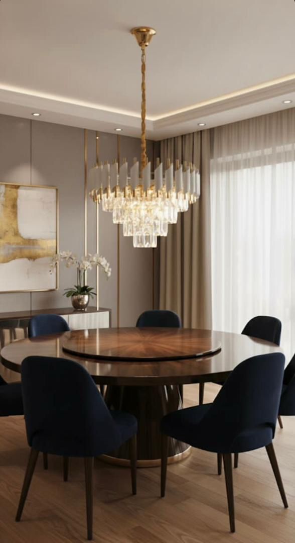 Tiered crystal chandelier over a round dining table