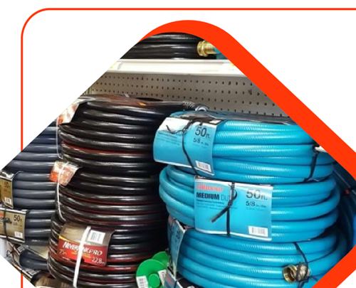 Coiled blue and black electrical cables on a shelf